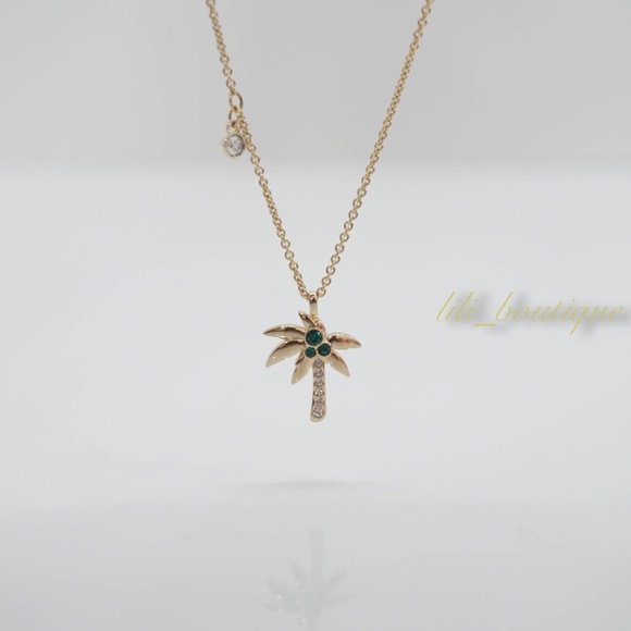 NIB Swarovski 5371158 Palm Pendant Necklace Clear Crystal Green Gold Plated $99 - Picture 1 of 9